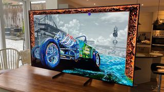 8K OLED TV: LG OLED77Z3 on a kitchen table with a car on screen