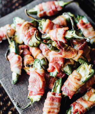 Bacon wrapped jalapeno poppers cooked in a pizza oven