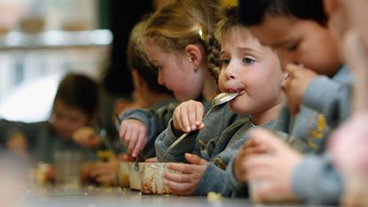 LONDON, UNITED KINGDOM - SEPTEMBER 30: Pupils at Putney Park School sit down for their lunch on September 30, 2008 in London, England. (Photo by Cate Gillon/Getty Images)