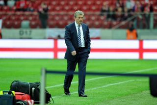 Roy Hodgson inspects the pitch before England's World Cup qualifier in Warsaw