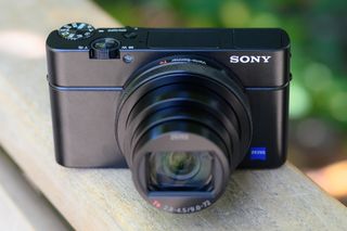 The Sony RX100 VII compact camera resting on a wooden ledge