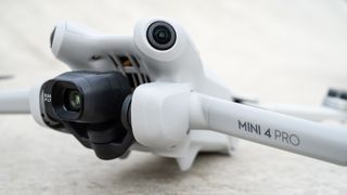 DJI Mini 4 Pro close up of camera and propeller arm