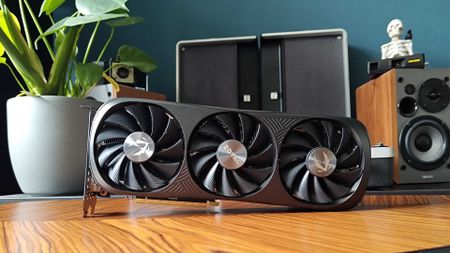 Nvidia GeForce RTX 4070 Super on woodgrain table with fans facing forward