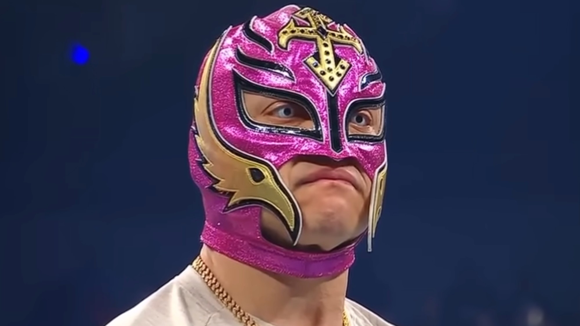 Rey Mysterio staring down Dominik Mysterio in the ring. 