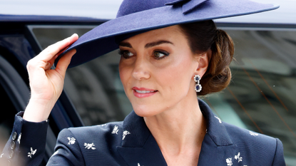 Catherine, Princess of Wales holds onto her hat in the wind as she attends the 2023 Commonwealth Day Service at Westminster Abbey on March 13, 2023 in London, England. The Commonwealth represents a global network of 56 countries, having been joined by Gabon and Togo in 2022, with a combined population of 2.5 billion people, of which over 60 percent are under 30 years old.