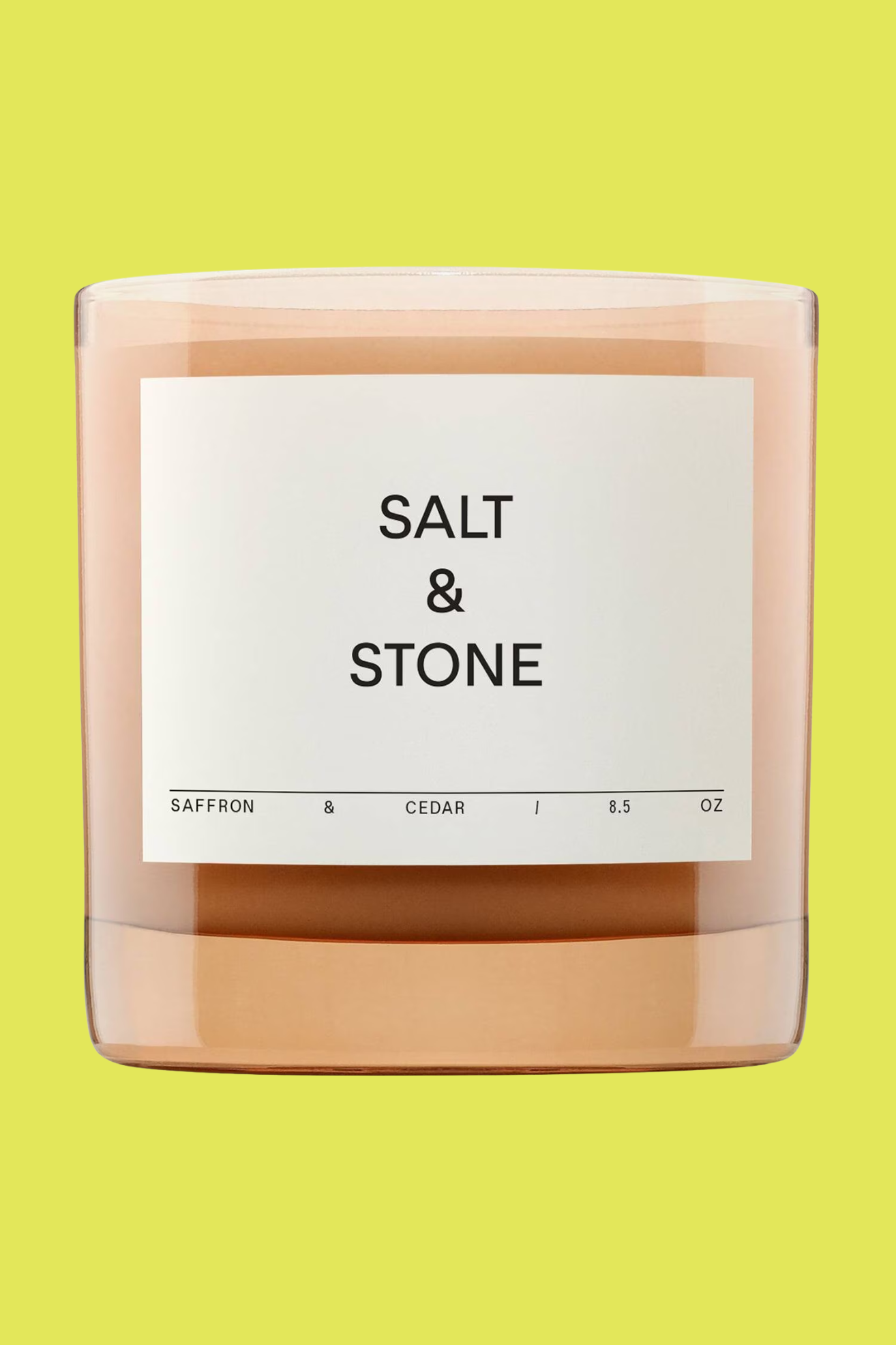 A sand-colored glass candle