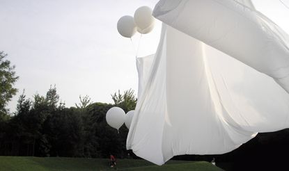 white sheets with white balloons