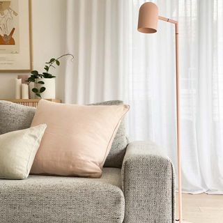 living room with pink floor lamp