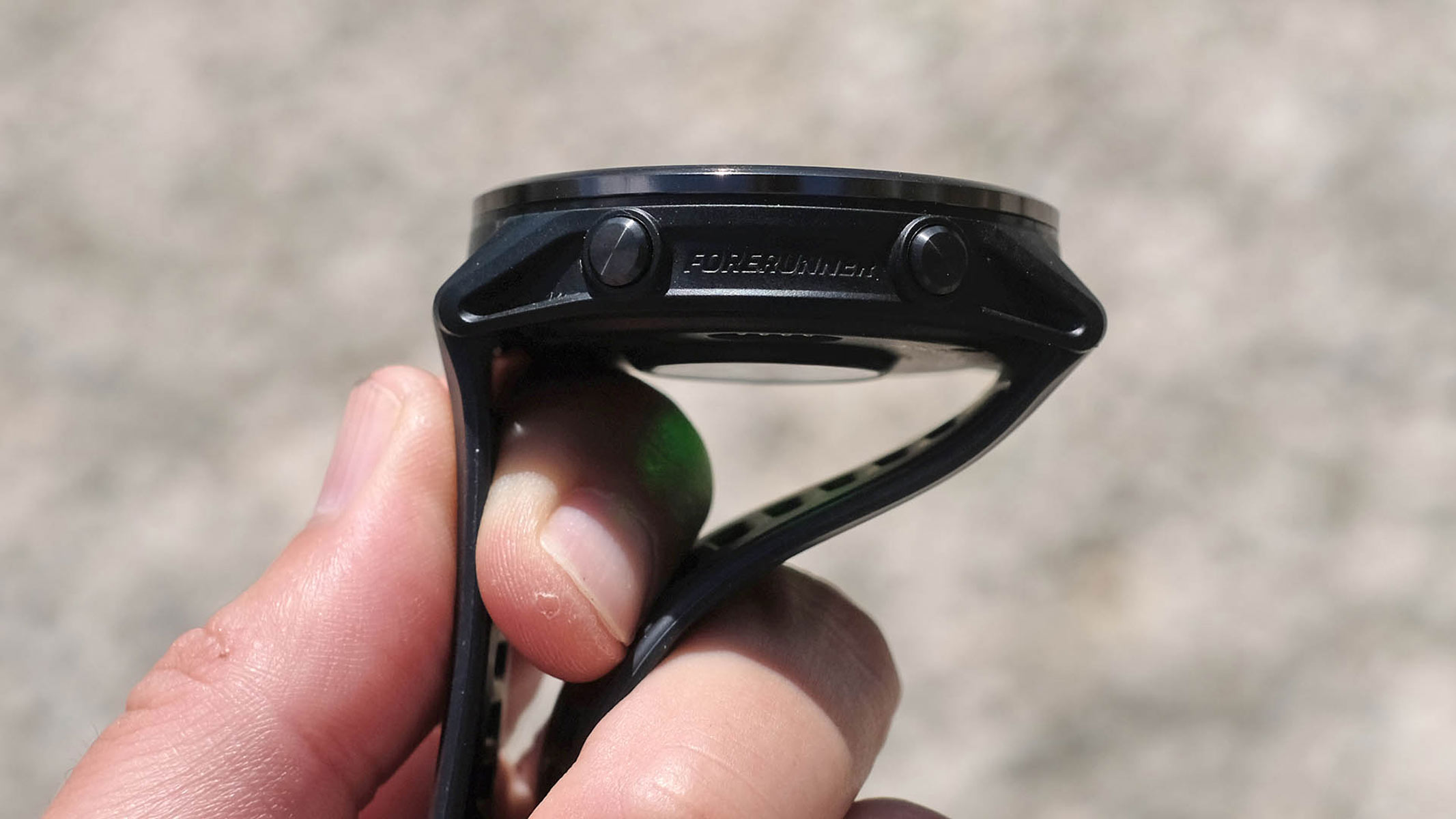 A close-up picture of the side buttons on the Garmin Forerunner 570