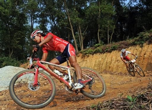 The men's cross country became a two-man race between Chun Hing Chan (Hong Kong, China), left, and Kohei Yamamoto (Japan).