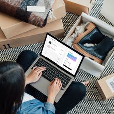 Woman shopping on her laptop