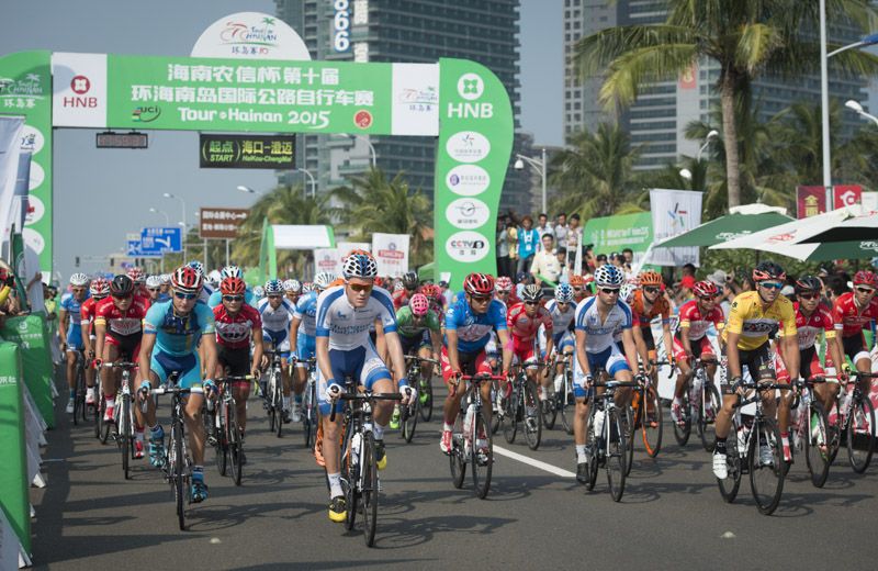 Riders roll out from the start in Haikou