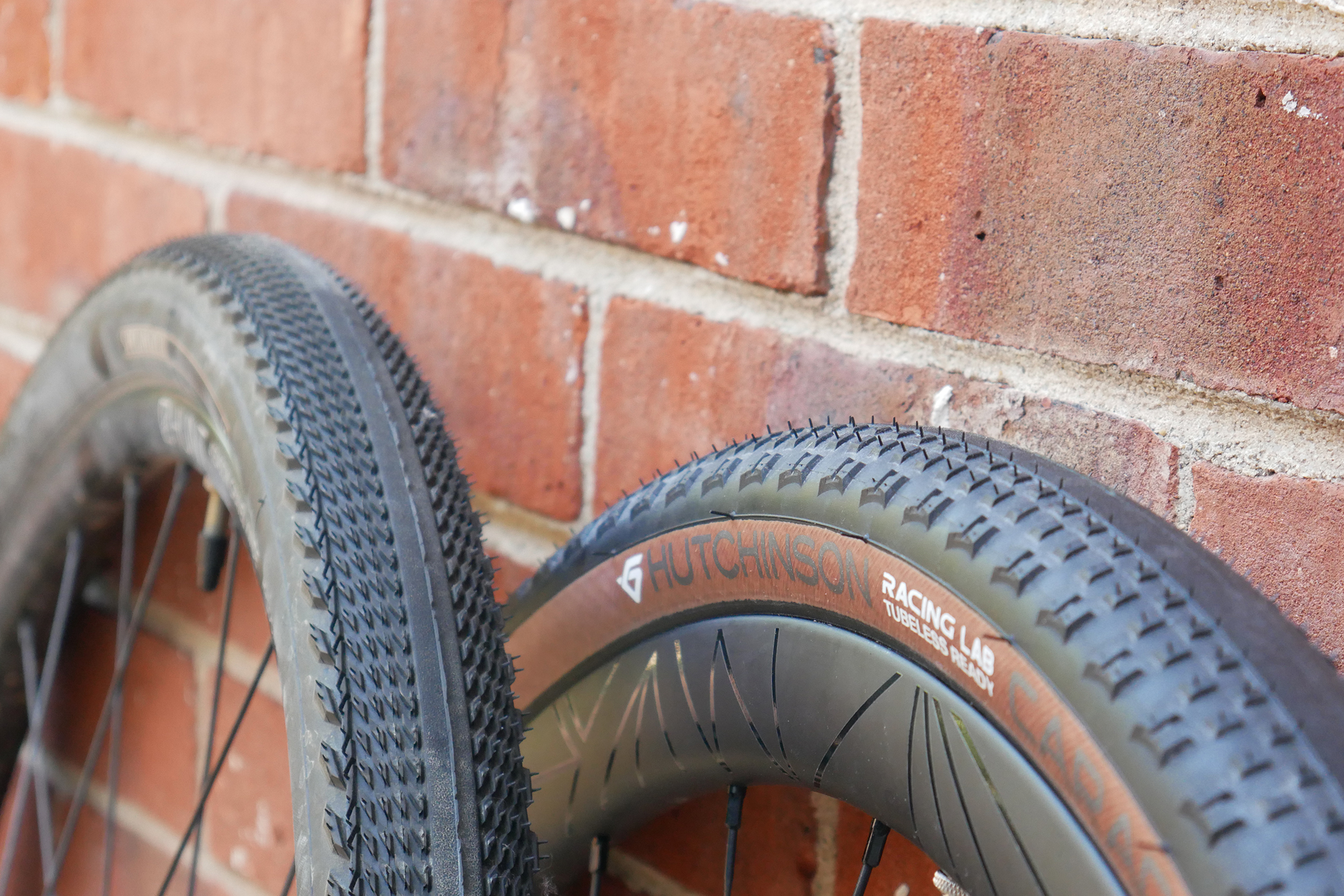 Hutchinson Caracal Race sat next to a specialized pathfinder gravel tyre for comparison