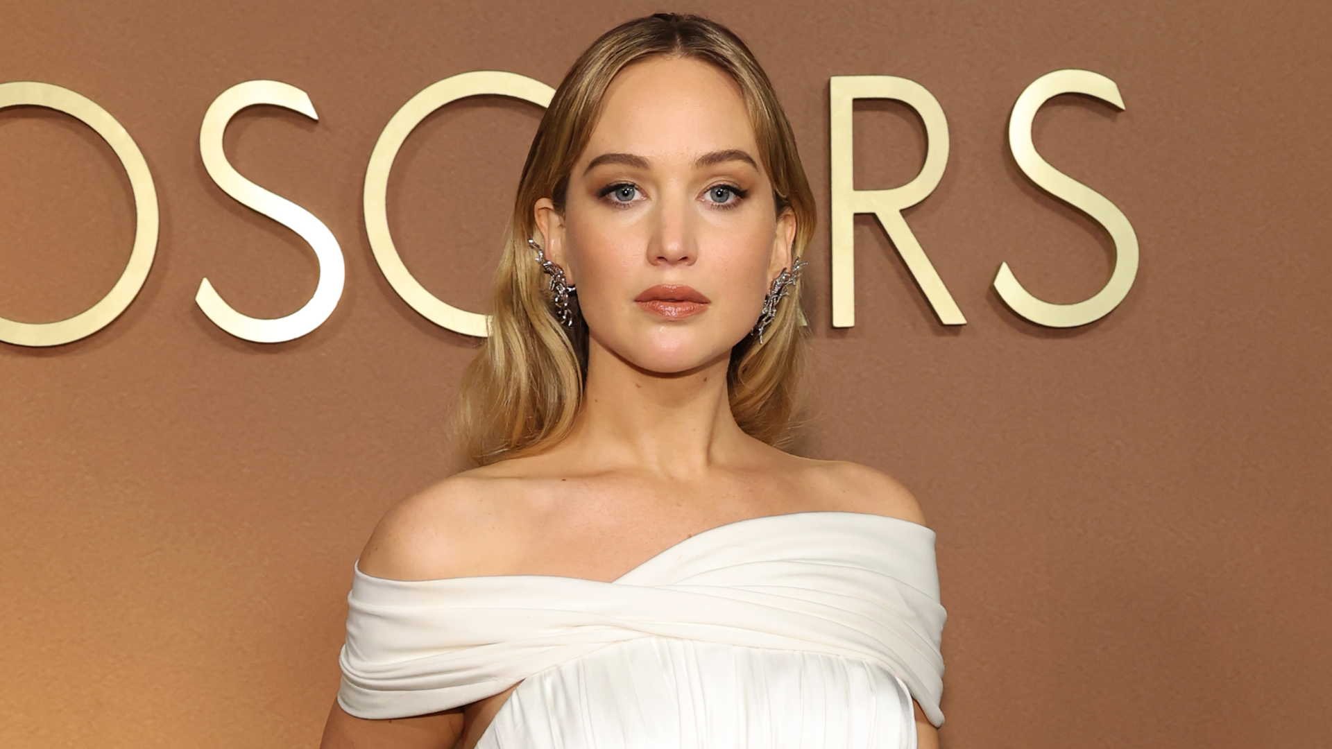 Jennifer Lawrence wore a custom white Dior dress at the 2025 Governors Awards