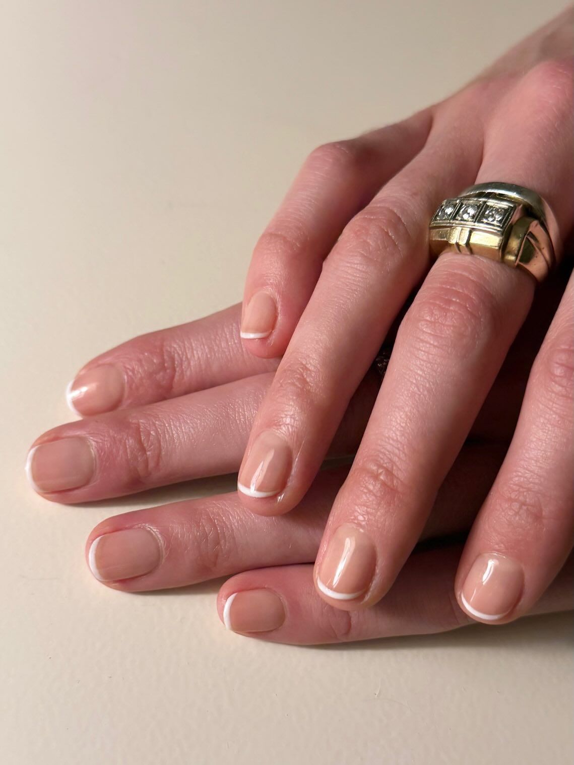 super skinny white french tips on short natural looking nude nails