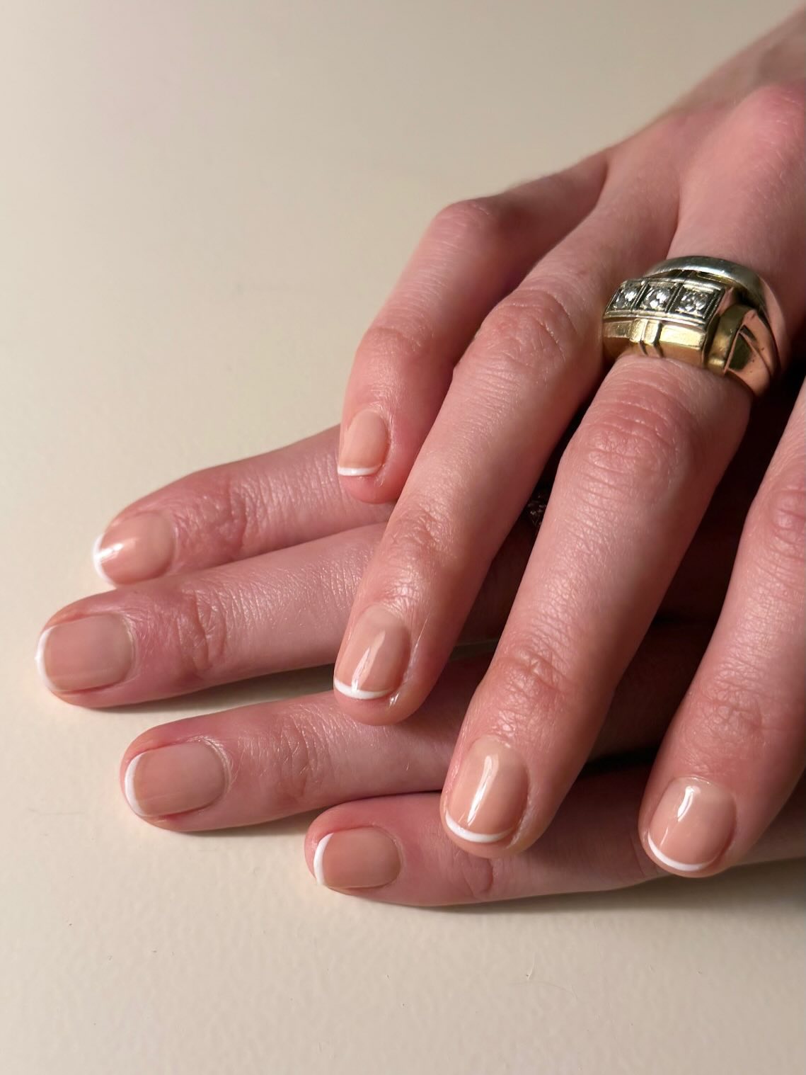 super skinny white french tips on short natural looking nude nails