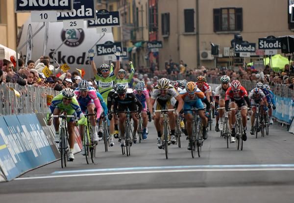 Daniele Bennati's Liquigas teammates are already celebrating as the Italian approaches the finish.