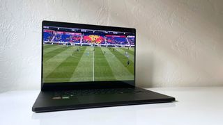 The ASUS ProArt P16 playing highlights from an NWSL soccer match on a white table