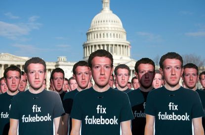Cardboard posters of Facebook CEO Mark Zuckerberg in Washington