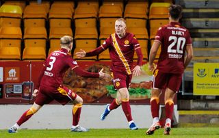 Arsenal on loan Motherwell's Mika Biereth (C) celebrates his goal to make it 2-2 with teammates Gerogie Gent (L) and Shane Blaney (R) during a cinch Premiership match between St Johnstone and Motherwell at McDiarmid Park, on November 07, 2023, in Perth, Scotland. (Photo by Ross Parker/SNS Group via Getty Images)