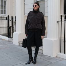 Influencer Sarah Louise Blythe wearing a zara funnel-neck jacket.
