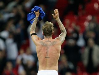 England's David Beckham applauds after their 2010 World Cup qualifying soccer match against Ukraine