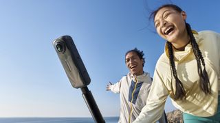 Insta360 X5 360 camera on a selfie stick