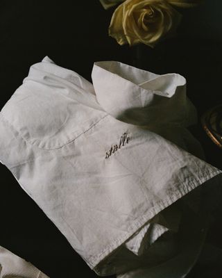 a robe from Stalle Studios folded on a counter