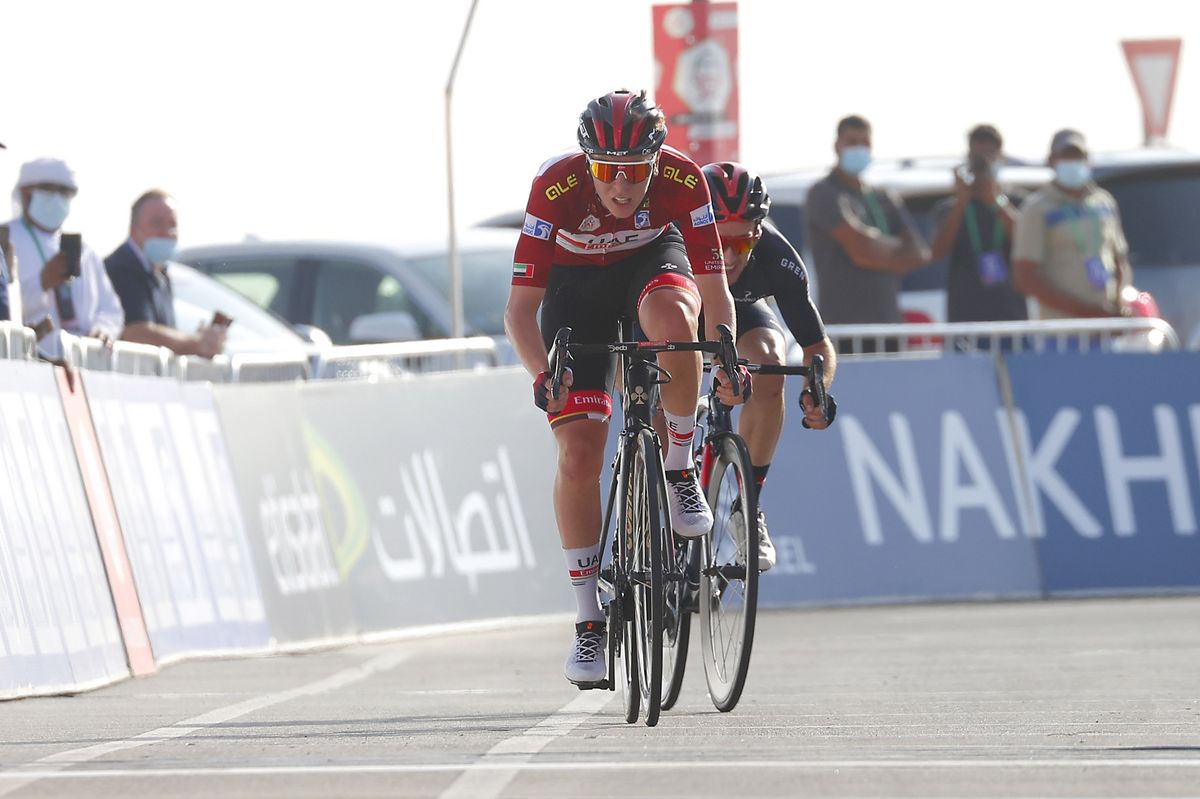 Tadej Pogacar sprints out of the last corner to win on Jebel Hafeet