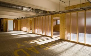 Studio spaces with opaque polycarbonate walls to allow the outside light through