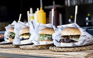 four burgers in food truck