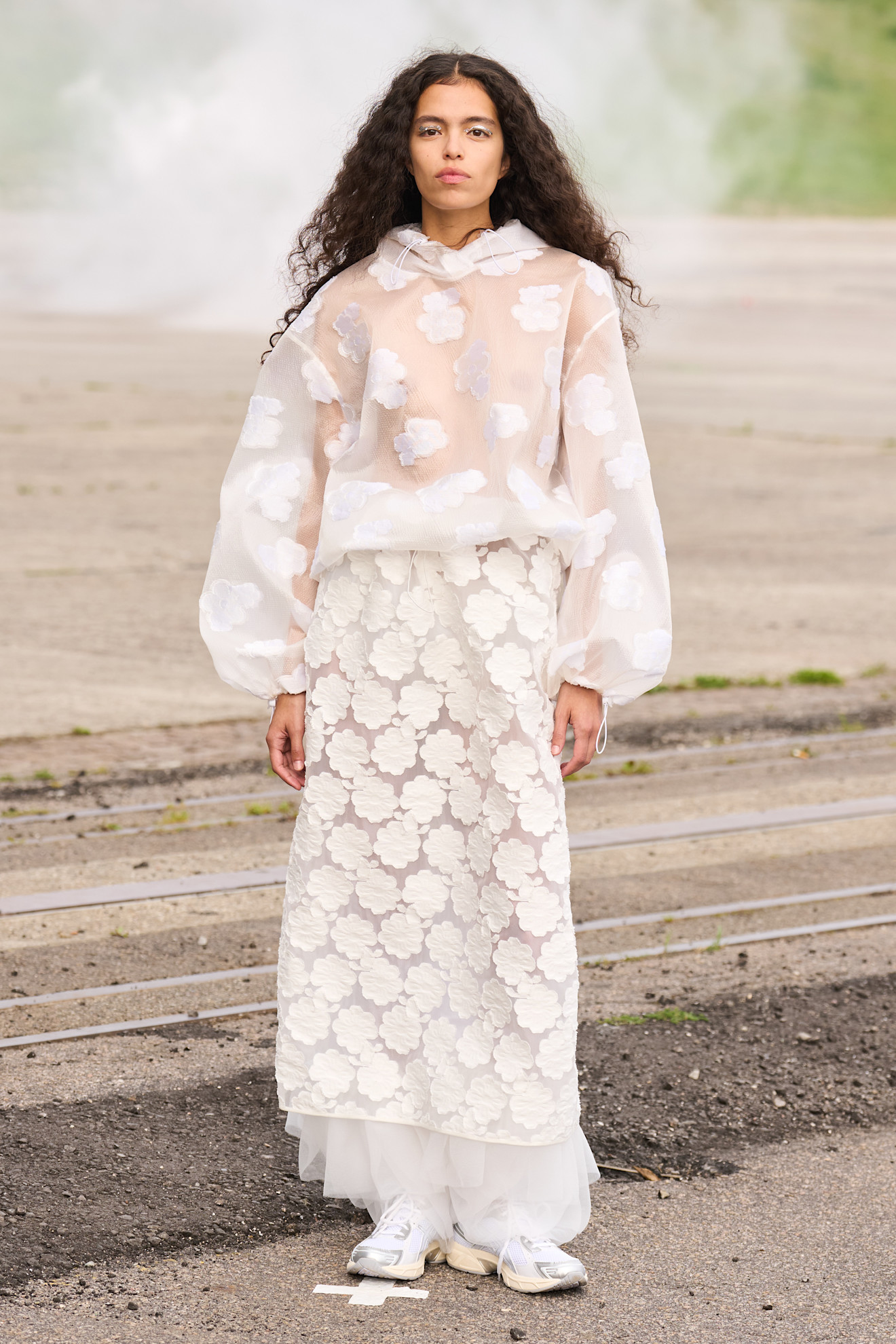 Model wears textured flowers on Cecilie Bahnsen's 2026 summer track.