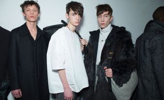 Male models wearing white and black clothes from the Lanvin AW2015 collection