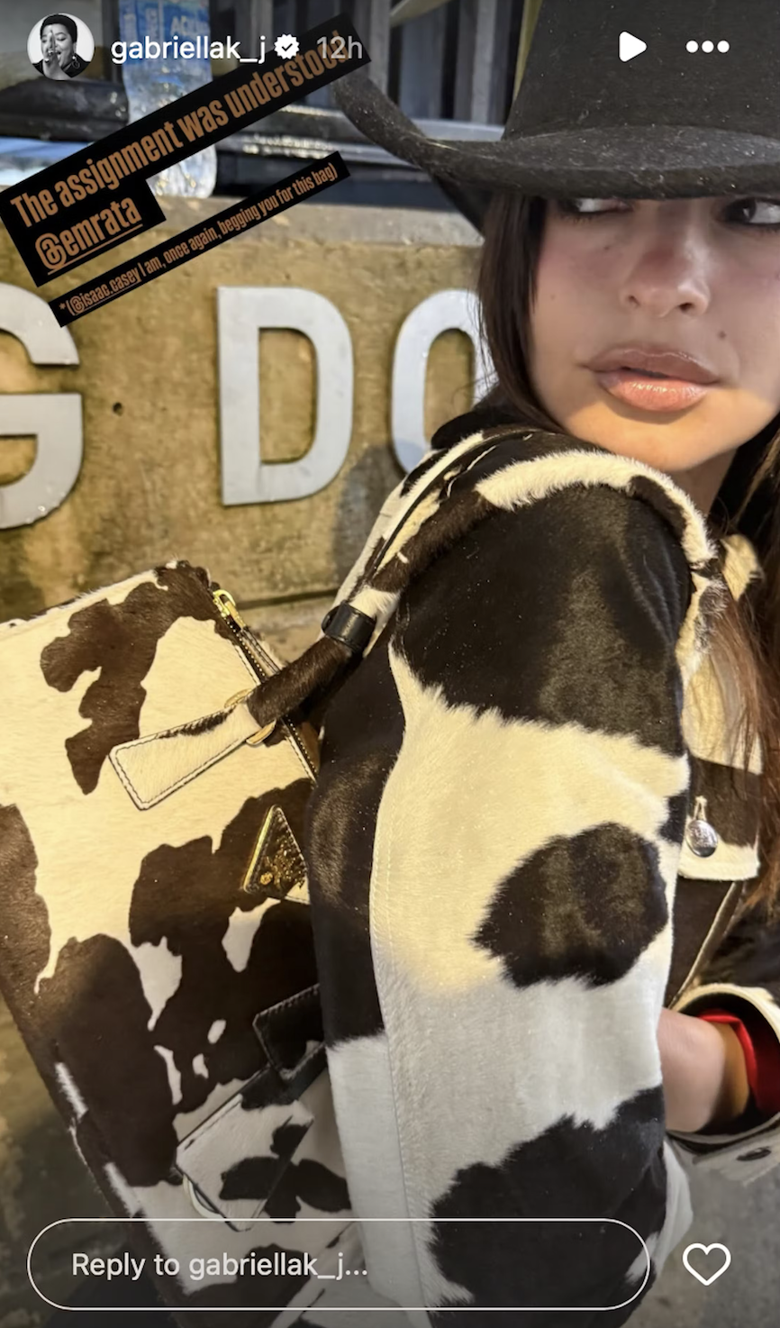 Emily Ratajkowski wears a Prada cowhide bag to Beyoncé's May 28 concert.