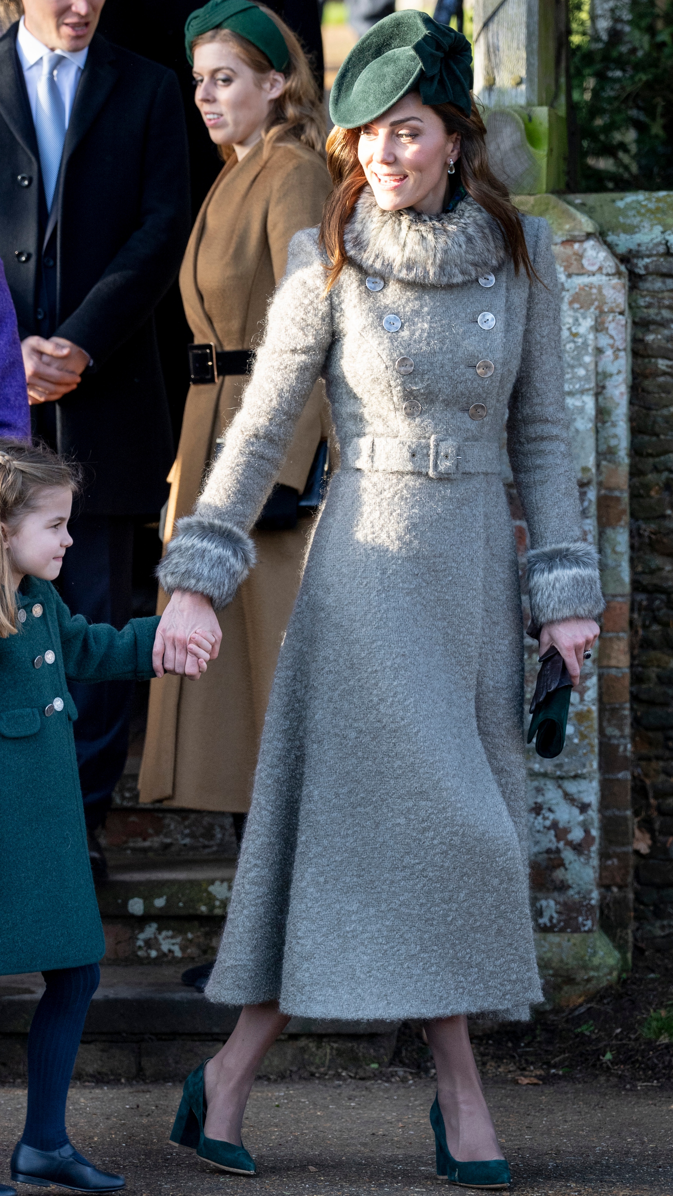 Catherine, Princess of Wales holds Princess Charlotte&#039;s hand as they leave after attending the Christmas Day Church service at Church of St Mary Magdalene on December 25, 2019