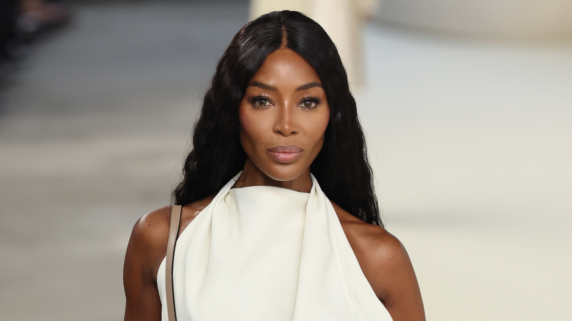 Naomi Campbell is spotted in Paris wearing a denim Adidas tracksuit and chunky sneakers