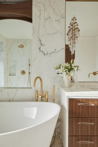 A bathroom with brass fixtures