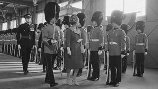Queen Elizabeth II inspecting guards upon her arrival in Quebec