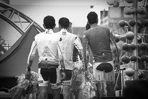 The tour jersey competition leaders make their way off the podium in Tampin.