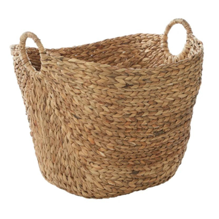 A cutout image of a seagrass laundry basket with handles
