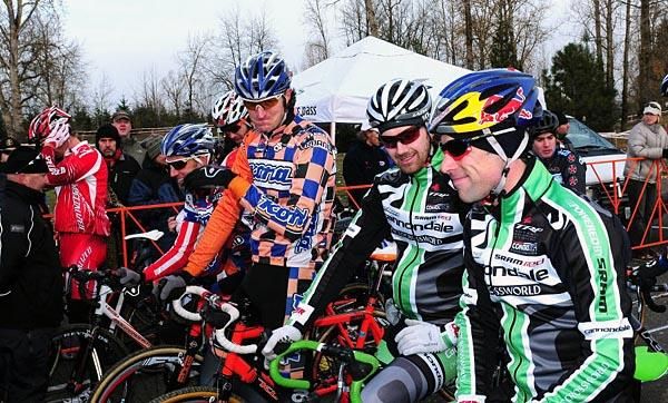 The elite men wait until the last second to remove their jackets due to the cold weather.