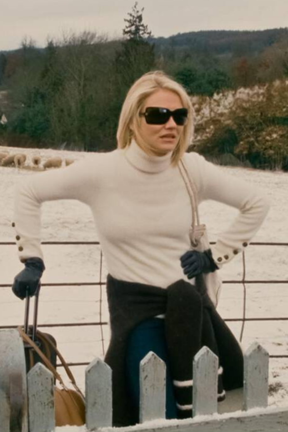 Amanda Woods wears cream jumper black trousers