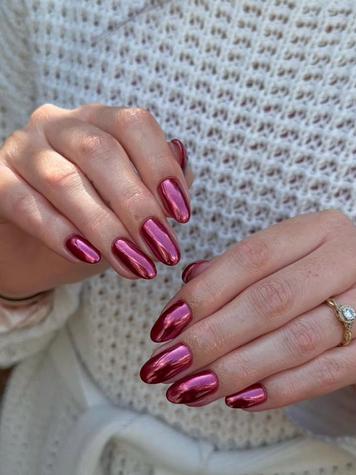Metallic pink nails.