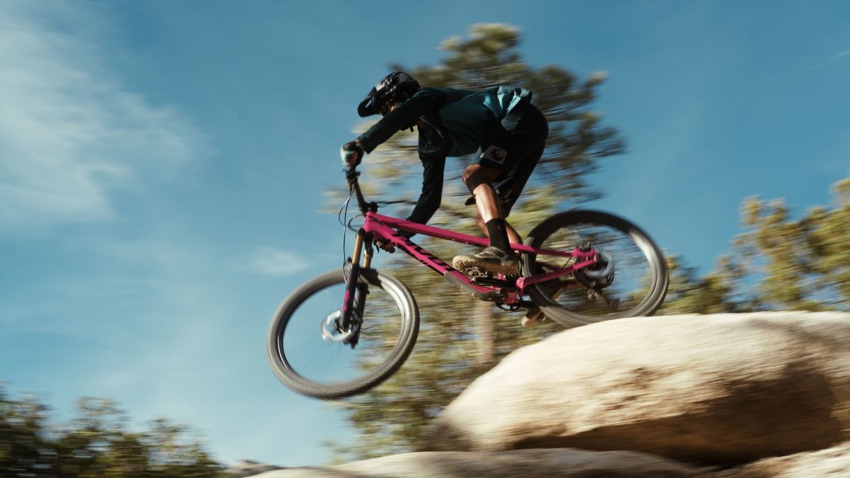 Rider jumping of a rock on Pivots new Shadowcat bike