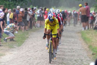 Wout van Aert leads the peloton over the cobbles on stage five of the 2022 Tour de France