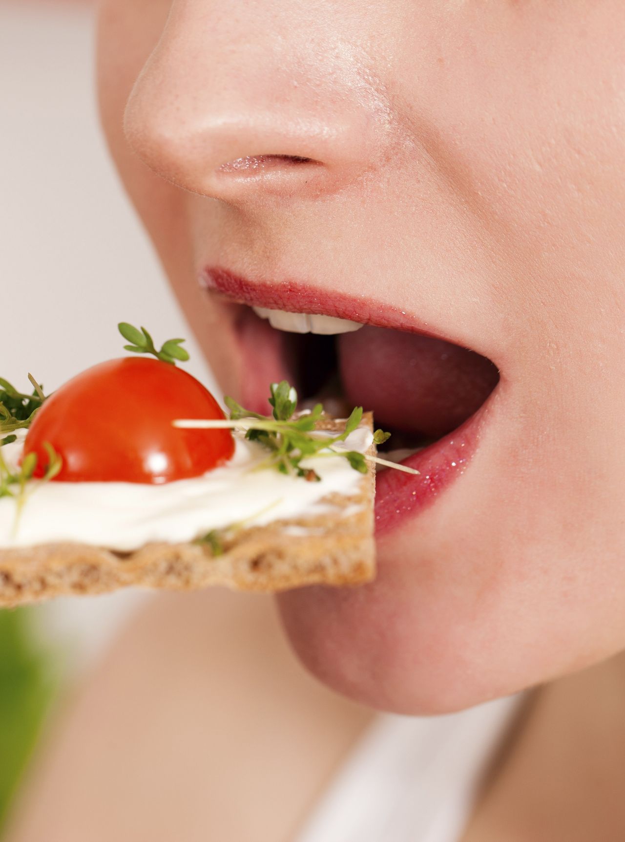 Woman eating a crispbread