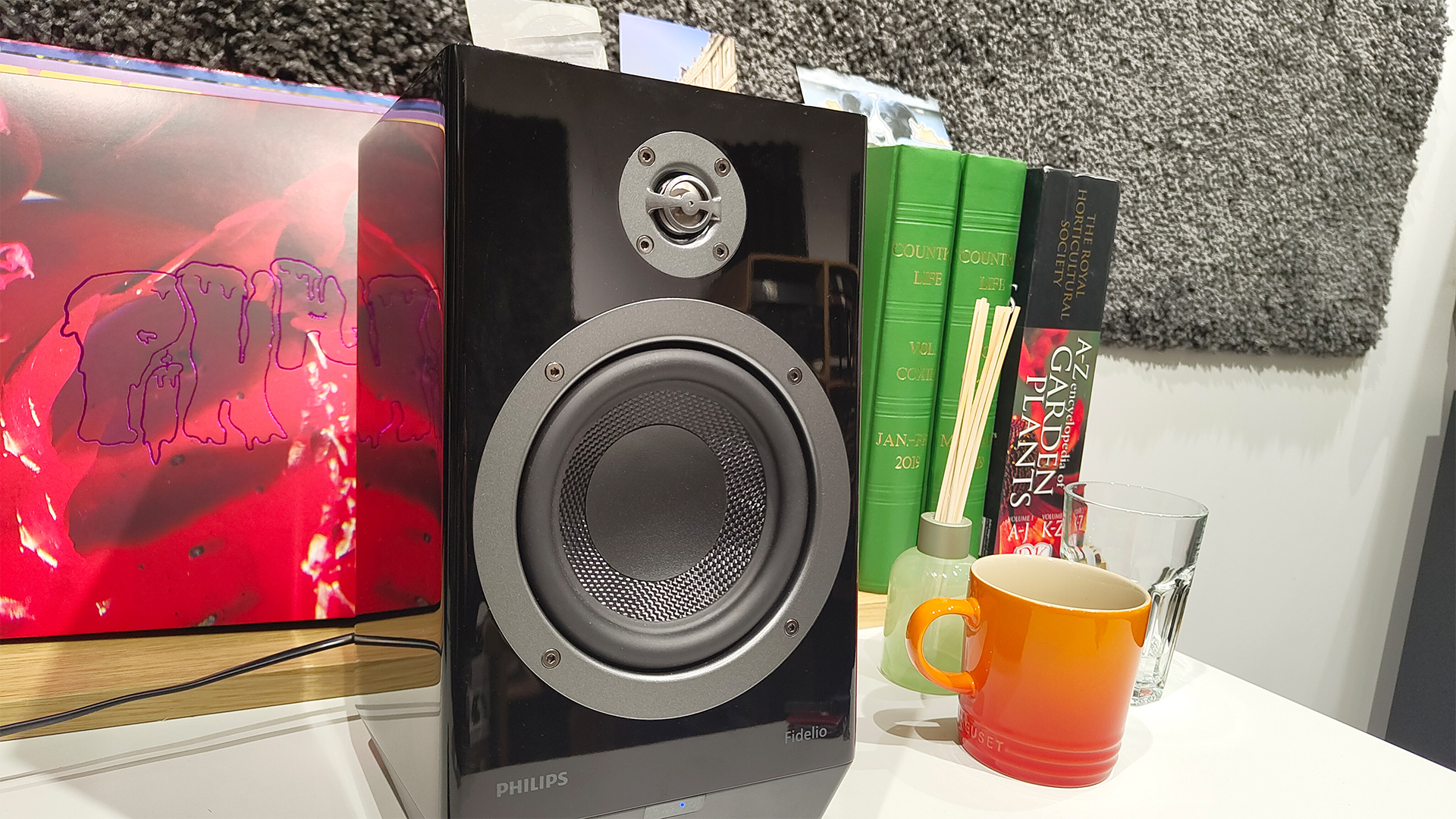 Philips Fidelio FA3 desktop speakers, one speaker next to orange mug