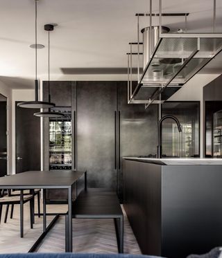 Dark minimalist kitchen in Los Angeles apartment