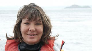 RNLI volunteer Joanne Wibberley working at sea smiling
