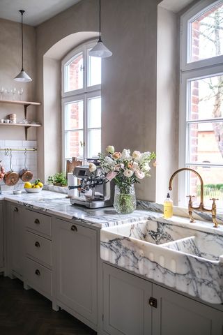 relaxed looking kitchen with marble sink